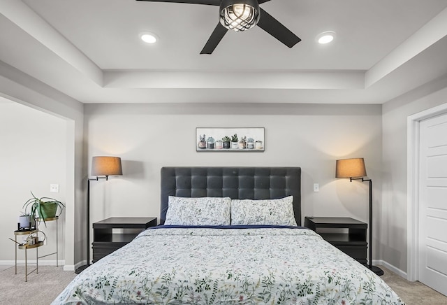 bedroom featuring recessed lighting, baseboards, a raised ceiling, and carpet flooring