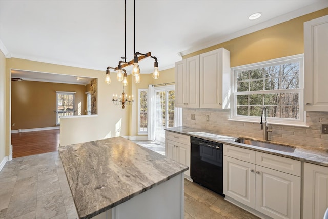 kitchen with black dishwasher, light stone countertops, backsplash, and a sink