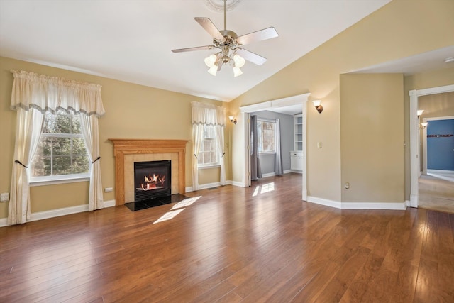 unfurnished living room with a wealth of natural light and hardwood / wood-style floors