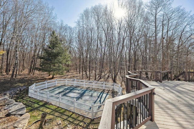 view of pool with a wooden deck