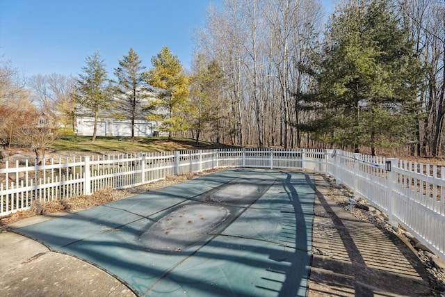 view of pool with fence