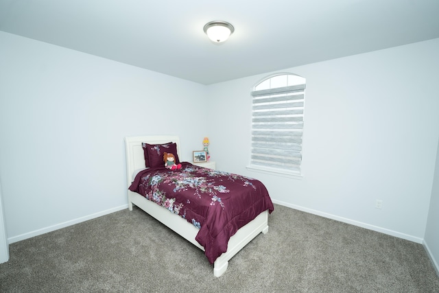 carpeted bedroom with baseboards