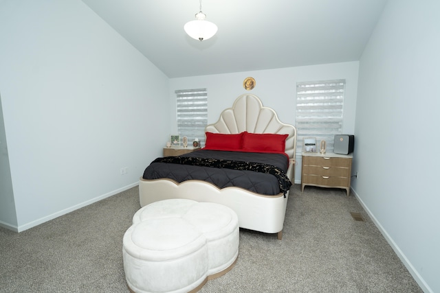 bedroom featuring lofted ceiling, carpet flooring, and baseboards