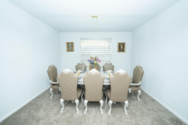 dining area with carpet floors and baseboards