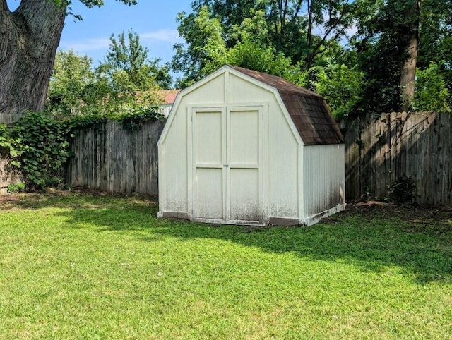 view of shed with a fenced backyard