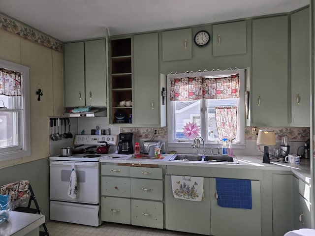 kitchen featuring white electric range oven, open shelves, a sink, and light countertops