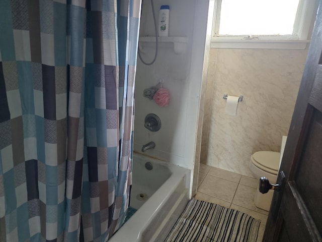 bathroom with shower / tub combo, toilet, and tile patterned floors