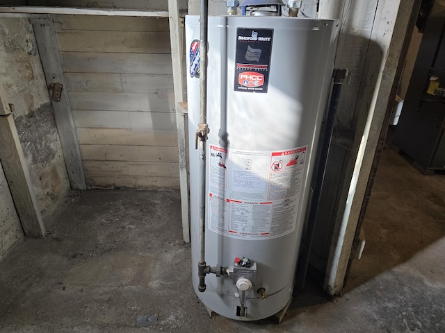 utility room featuring gas water heater