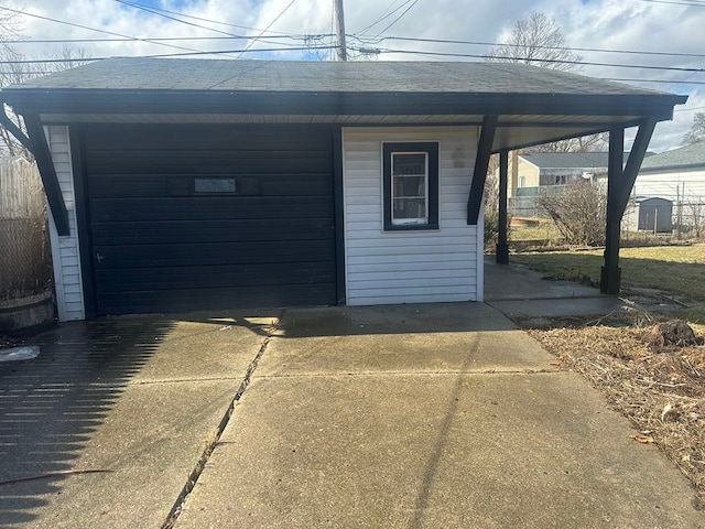 detached garage featuring driveway