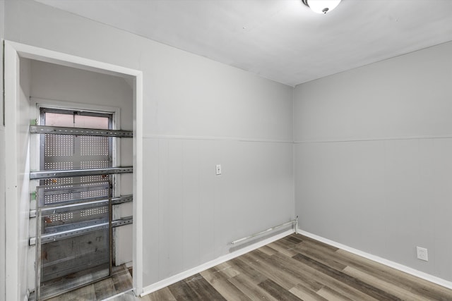 empty room featuring wood finished floors