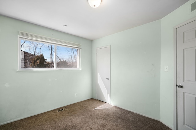 unfurnished bedroom with visible vents and carpet floors