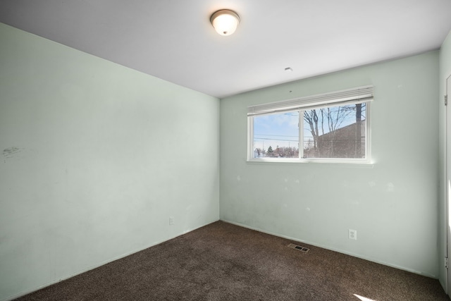 carpeted spare room with visible vents