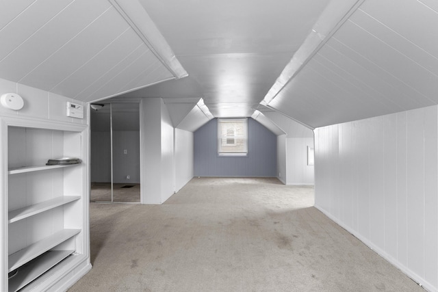 bonus room featuring carpet floors and lofted ceiling