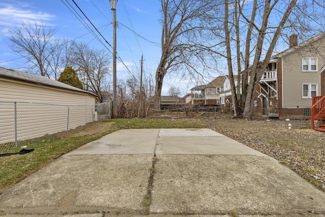 view of yard featuring fence and a patio