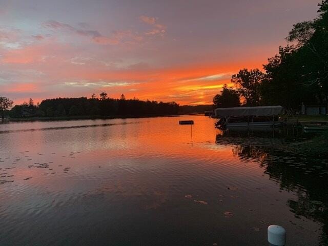 property view of water featuring a boat dock