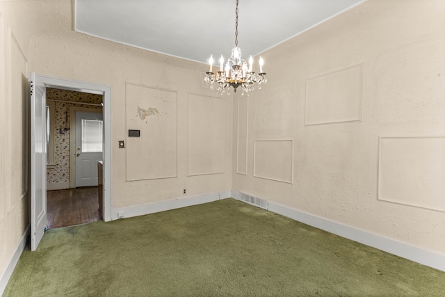 empty room featuring baseboards, visible vents, a textured wall, carpet, and a notable chandelier