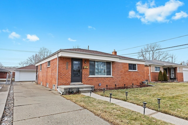 view of front facade with a chimney, a front lawn, an outdoor structure, and brick siding