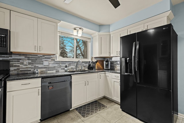 kitchen with black appliances, a sink, white cabinets, and decorative backsplash