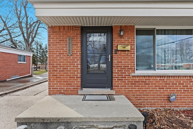 entrance to property with brick siding