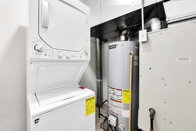 laundry room with stacked washer / drying machine, laundry area, and water heater