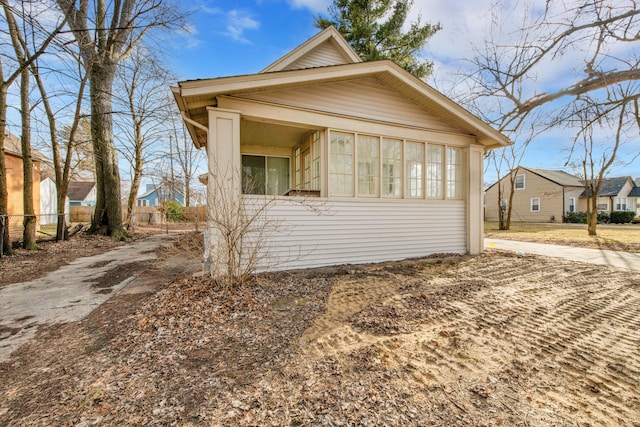 view of home's exterior with fence