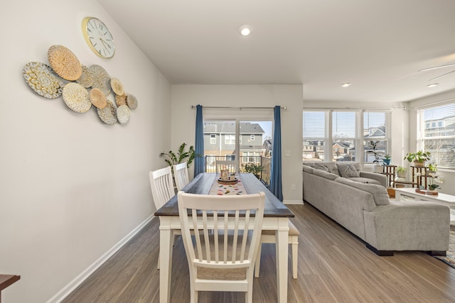 dining area with recessed lighting, wood finished floors, and baseboards