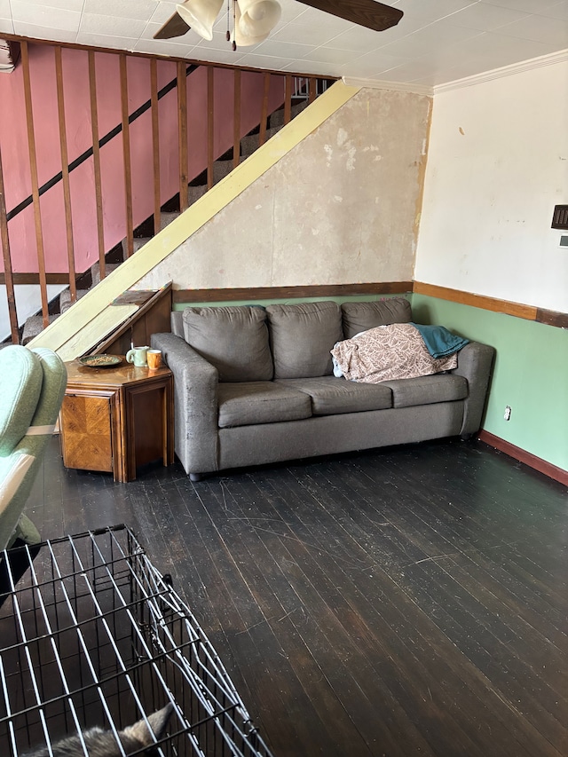 unfurnished living room featuring baseboards, ceiling fan, stairway, a wall mounted air conditioner, and hardwood / wood-style flooring