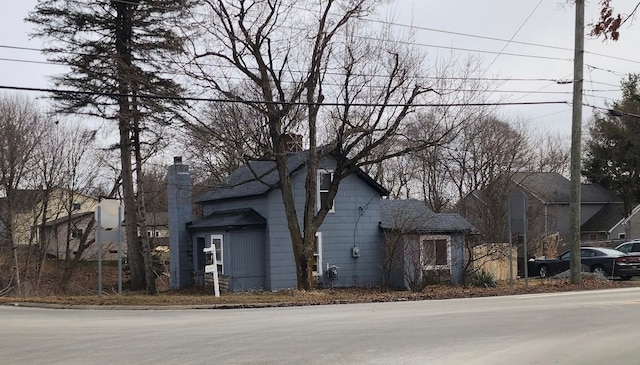 view of front of home with a chimney