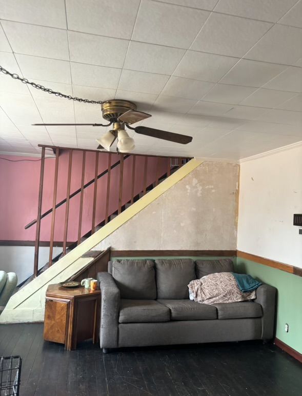 living room featuring hardwood / wood-style floors and vaulted ceiling