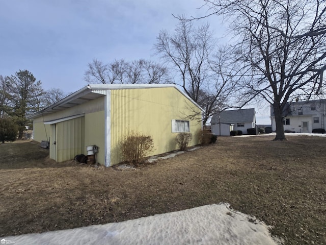 view of property exterior with an outbuilding