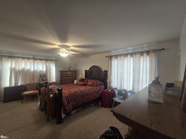 carpeted bedroom with a ceiling fan