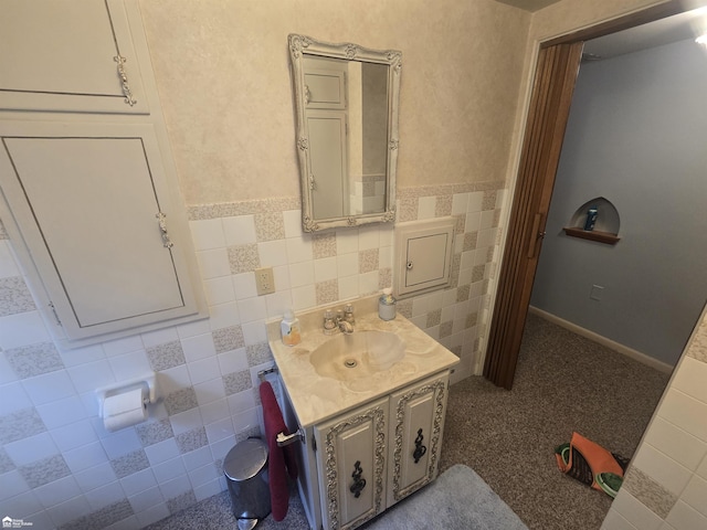 bathroom featuring tile patterned flooring, vanity, and tile walls