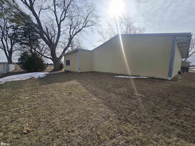 view of property exterior featuring a lawn