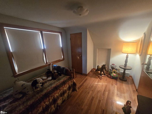 bedroom with wood finished floors