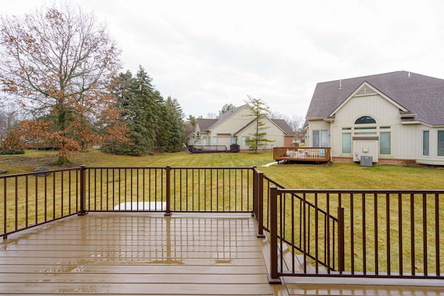 wooden deck featuring a yard