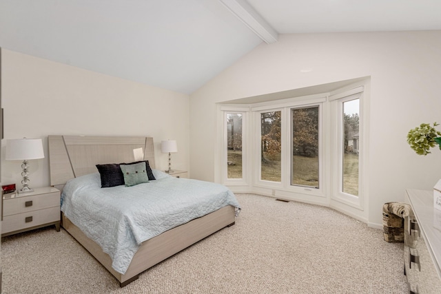 carpeted bedroom with visible vents and lofted ceiling with beams