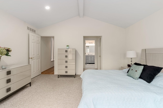 bedroom with vaulted ceiling with beams, visible vents, connected bathroom, and light colored carpet