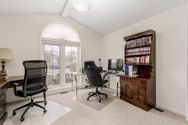 carpeted office space featuring vaulted ceiling with beams and baseboards