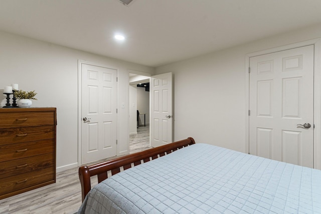 bedroom featuring recessed lighting, light wood-style flooring, and baseboards