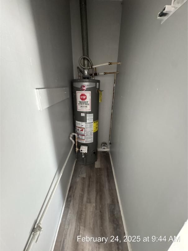 utility room featuring gas water heater