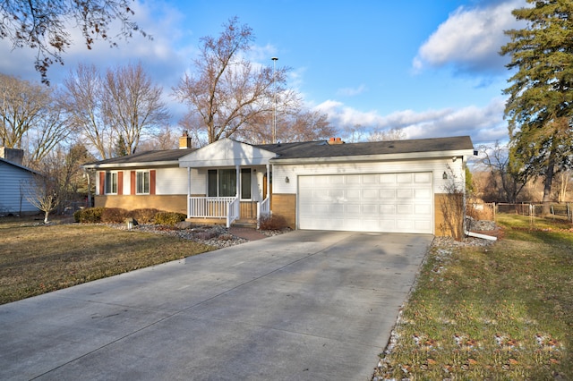 ranch-style house featuring a porch, concrete driveway, a front yard, fence, and a garage