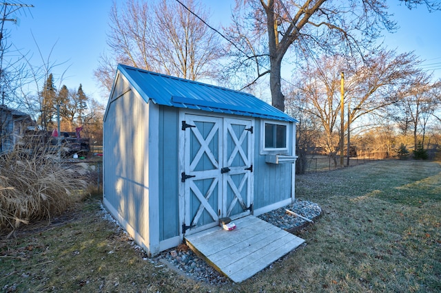 view of shed with fence