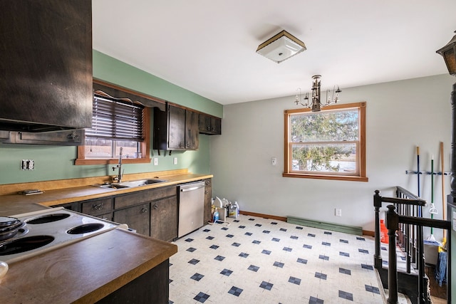 kitchen featuring dishwasher, plenty of natural light, baseboards, and a sink