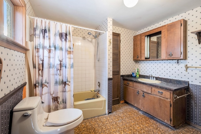 full bath with shower / bathtub combination with curtain, vanity, toilet, and wallpapered walls