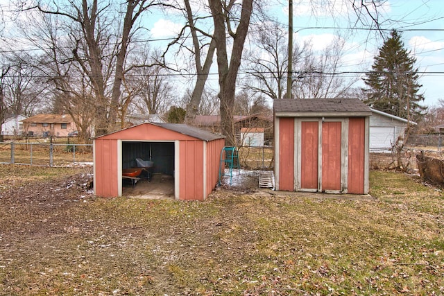 view of shed featuring fence