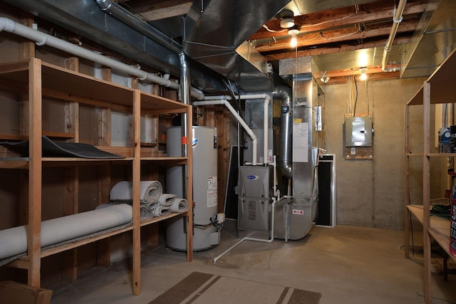 utility room featuring gas water heater, electric panel, and heating unit