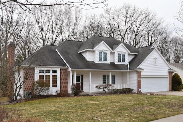 view of front of home with a garage, a front lawn, a porch, and brick siding