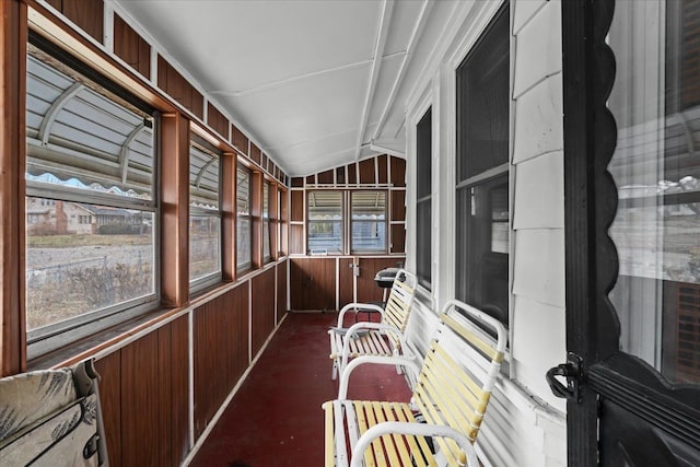 sunroom featuring lofted ceiling