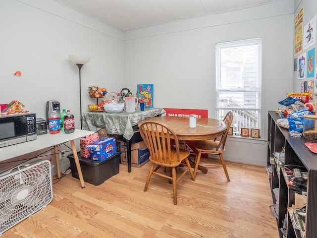 rec room with light wood-style flooring