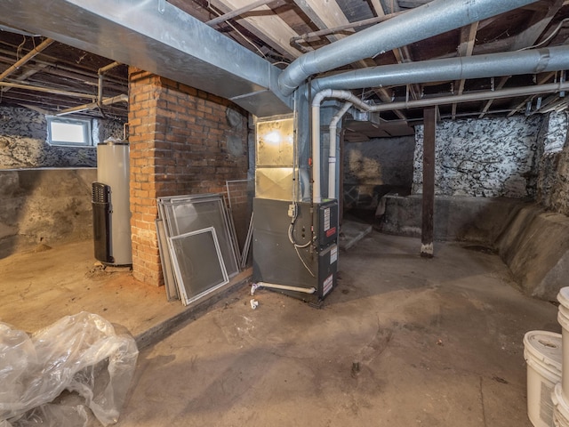 basement featuring heating unit and gas water heater